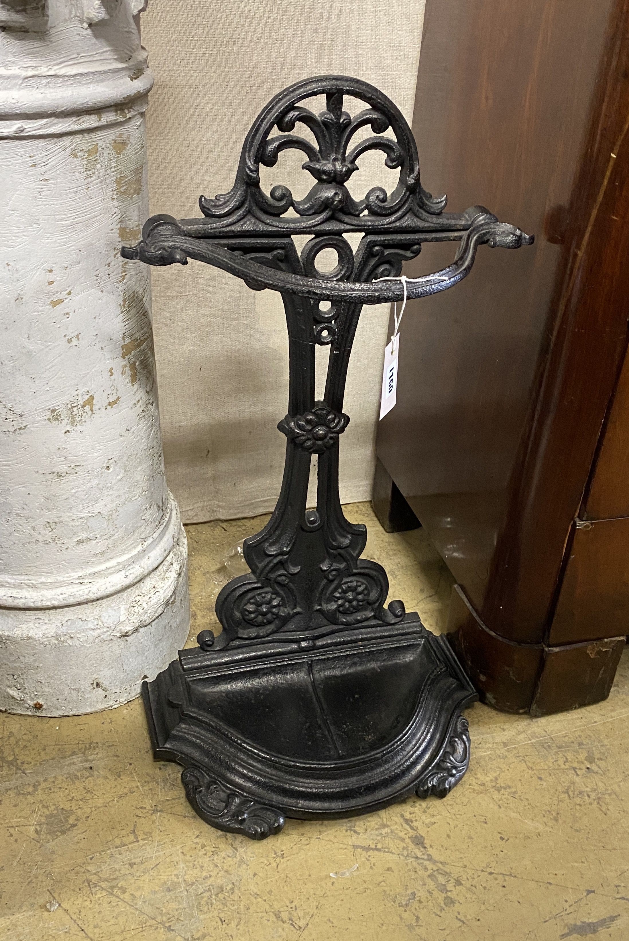 A Victorian style black painted cast iron stick and umbrella stand, width 38cm, height 77cm